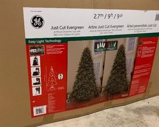 9ft pre lit evergreen Christmas tree
New in box 