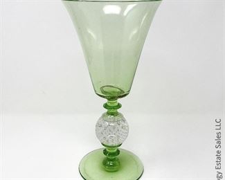 #20 Green footed vase w/ repair; base of vase has been reglued to stem. AS IS. 6" x 12" $25