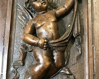 Wood and Painted Iron High Relief Panel, Cherub