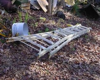 Several ladders of various sizes, log chains of every gauge and length