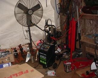 Several floor jacks, and dozens of jack stands