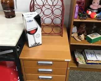 Wooden filing cabinet and Wine bottle holder.