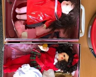Dolls with suitcase.