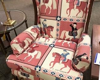 Beautifully covered chair in horse pattern.