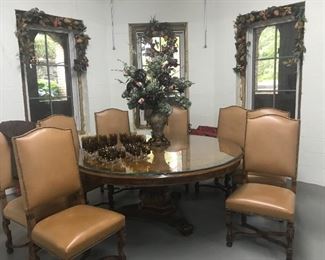 Karges 70" Round Table with 8 highback leather chairs.