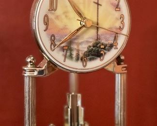 Thomas Kinkade Sunrise Clock	9in H x 6in Diameter	
