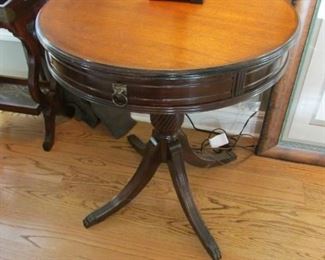 Mahogany drum table. With one apron drawer. Minor scratches on top and faint water ring. $65
