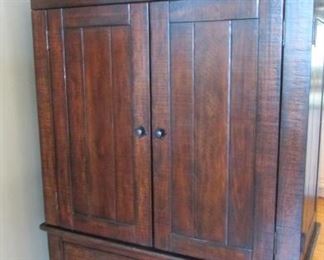 Oak armoire or television cabinet. With small dent to the edge of the top. H67”, W 47 ½”, D 24” $225