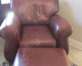 Leather arm chair and ottoman. White film on the back cushion and minor scratch on the ottoman. H 38”, W 24”, D 22 $200