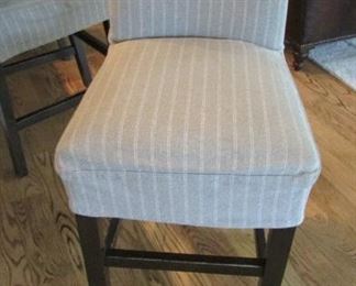 Five Quatrine bar stools. With linen cotton slip covers. With minor wear to the cross bars. H 42”, W 20”, D 21 ½” $125 each