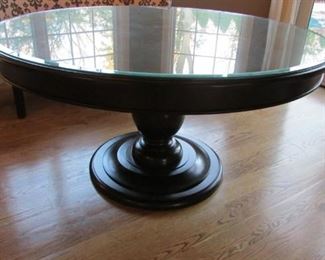 Quatrine black lacquered round dining table. With beveled glass cover. With minor scratch on the base. H 37”, diameter 59” $550