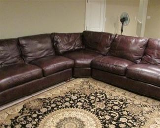 Thomasville leather sectional sofa. Minor wear on the cord trim of the seats. Each side 114” $1,000
