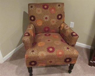 Upholstered arm chair. Fabric on the seat is rippled. H 34”, W 26”, D 28” $100