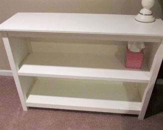 White bookshelf. The finish is worn. H 29”, L 42”, D 14” $30