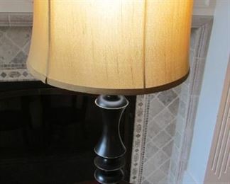 Black composition table lamp. With silk shade. With 3 small nicks on the base. Height with shade 24 3/4” $100