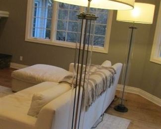Two Restoration Hardware Flatiron bronze finished and glass floor lamps. With white linen shades. H 75” $400 each