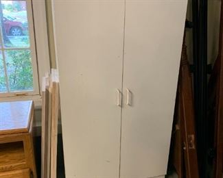 #143 White laminate 2 door cabinet 30x16x58 $30.00