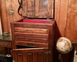 antique ice box filled with vinyl records