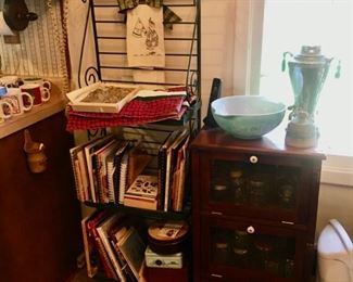 1 of several Bakers racks, this one filled with cookbooks