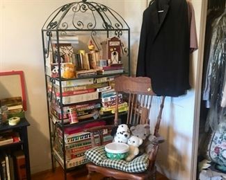 another iron shelving unit, birdcage style and antique rocker, mens clothes