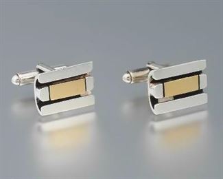 A Pair of Cartier Sterling Silver and 18k Gold Cufflinks 