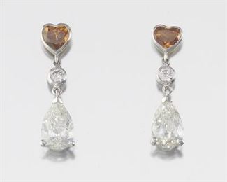 Pair of White and Natural Fancy Deep Brown Orange Diamond Earrings, GIA Report 