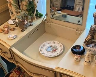 Vanity---center raises to display mirror