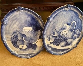 Two of four  blue and white wall plaques