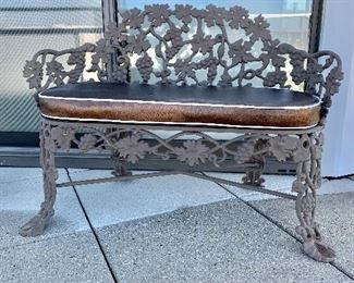 $550; Brown powder-coated iron two seat bench with custom removable cushion; 30"H x 41"W x 23"D; Bench #1