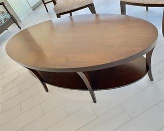 $225; Century oval cocktail table; Cordovan finish; . 20.25"H x 59"W x 29"D