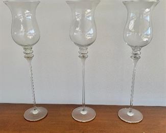 $225; Set of three Neiman Marcus glass hurricane candlesticks  -  25.5"H x 7"D