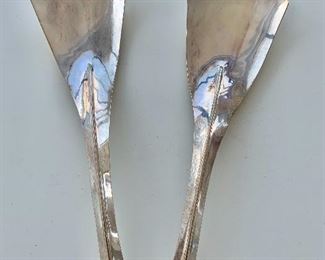 $375: Sterling silver contemporary salad servers;  11.5"L x 3.5"W; signed by metal crafter Yvonne Arrit