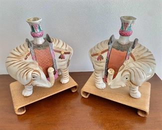 $225; Pair reproduction ceramic elephant candlesticks with teak base; 10.5"H x 9"W x 6"D