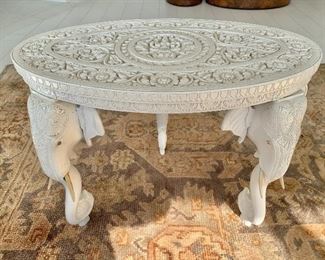 $495; Oval, carved ornate table with three "Elephant" legs - 18"H x 24"W x 14.5"D