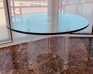 $695; Vintage, mid century modern glass top lucite bottom round breakfast table; unsigned;  27.75"H (glass is .75" thick) x 42"D