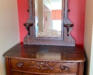 $225; Eastlake style walnut dresser with three drawers and mirror; C. 1919; 81.5H x 43.5"W x 22"D