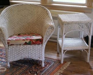 Small white wicker rocking chair