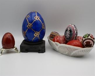 various egg collectibles and ceramic basket