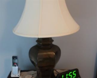 one  of two  brass  lamps