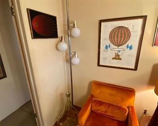 Great chrome pole lamp and crushed velvet arm chairs.