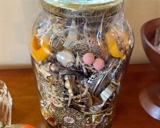 Large jar of broken jewelry.