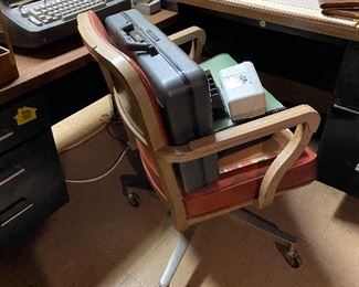 Office chair, Halliburton briefcase.