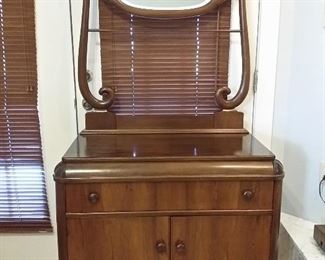 Walnut washstand with beveled mirror & towel bar.