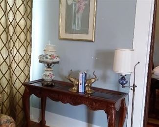 Vintage Gone With the Wind lamp, brass elephant bookends, antique floor lamp, sofa table with beveled glass insets