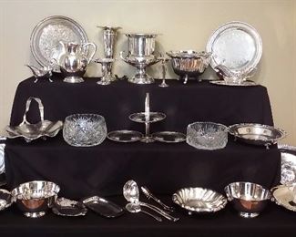 Several pieces of old silver plate serving pieces