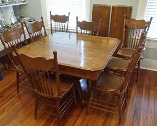 Antique oak table with 2 leaves & 8 oak pressback chairs