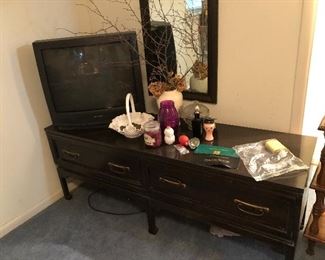Beautiful long black table with two drawers. Tv and misc