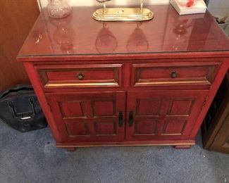 Red/orange colored table: opens up both sides with two drawers