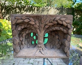 Folk art wood carving Eve at the apple tree            