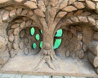 Folk art wood carving Eve at the apple tree              